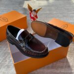 Tod’s Men’s Polished Burgundy Loafers with Chunky Metal Buckle