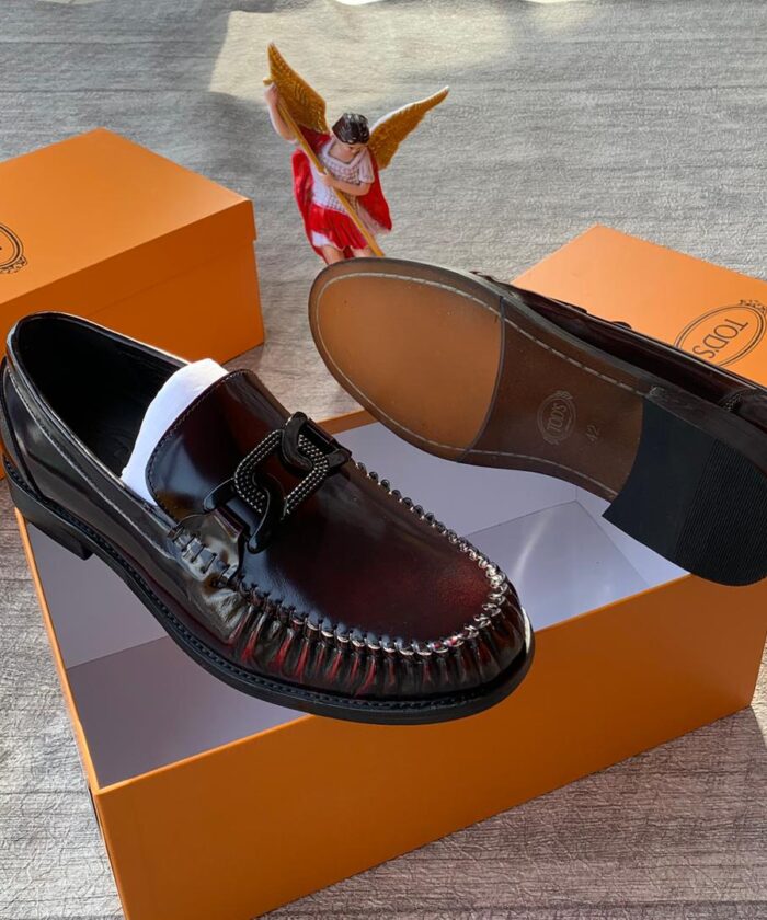Tod’s Men’s Polished Burgundy Loafers with Chunky Metal Buckle