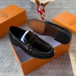 Tod’s Men’s Polished Black Loafers with Chunky Metal Buckle