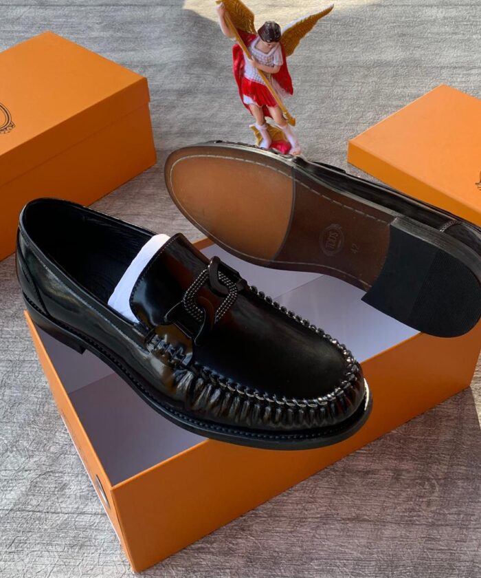 Tod’s Men’s Polished Black Loafers with Chunky Metal Buckle
