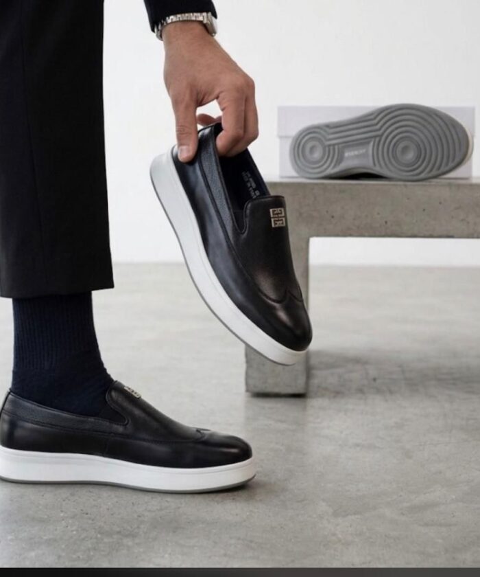 Givenchy Black Leather Slip-On Sneakers with Metal Emblem